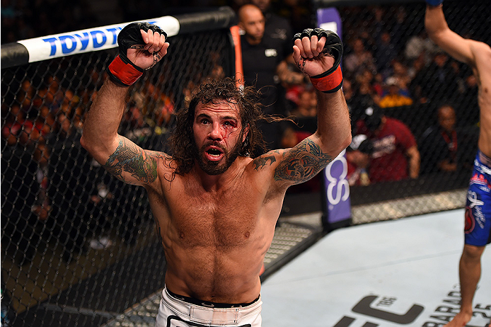 FAIRFAX, VA - APRIL 04: Clay Guida celebrates after defeating Robbie Peralta in their featherweight fight during the UFC Fight Night event at the Patriot Center on April 4, 2015 in Fairfax, Virginia. (Photo by Josh Hedges/Zuffa LLC/Zuffa LLC via Getty I