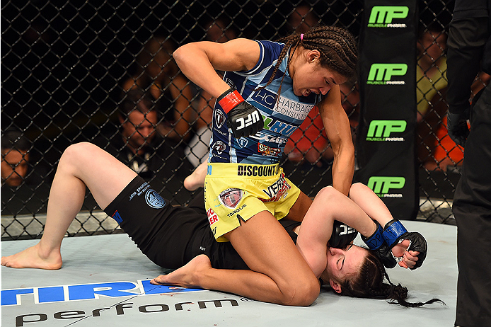 FAIRFAX, VA - APRIL 04: (L-R) Juliana Pena punches Milana Dudieva on the ground in their women's bantamweight fight during the UFC Fight Night event at the Patriot Center on April 4, 2015 in Fairfax, Virginia. (Photo by Josh Hedges/Zuffa LLC/Zuffa LLC vi