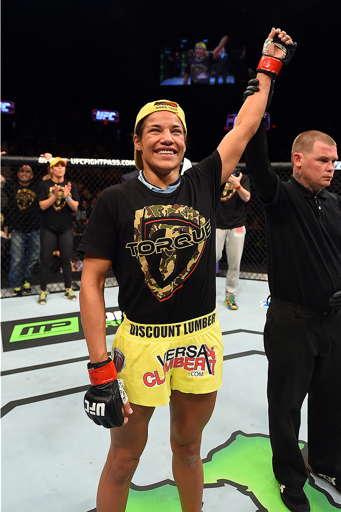 FAIRFAX, VA - APRIL 04: Juliana Pena celebrates after defeating Milana Dudieva in their women's bantamweight fight during the UFC Fight Night event at the Patriot Center on April 4, 2015 in Fairfax, Virginia. (Photo by Josh Hedges/Zuffa LLC/Zuffa LLC via