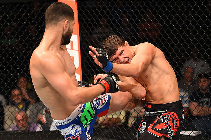 FAIRFAX, VA - APRIL 04: (L-R) Jorge Masvidal lands a kick against Al Iaquinta in their lightweight fight during the UFC Fight Night event at the Patriot Center on April 4, 2015 in Fairfax, Virginia. (Photo by Josh Hedges/Zuffa LLC/Zuffa LLC via Getty Ima
