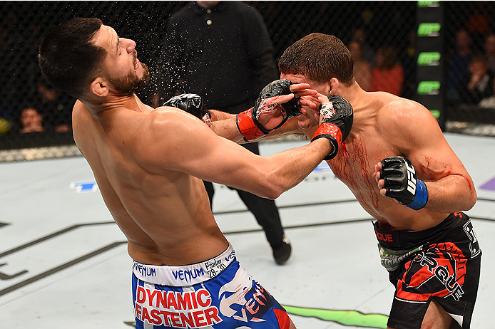 FAIRFAX, VA - APRIL 04: (R-L) Al Iaquinta punches Jorge Masvidal in their lightweight fight during the UFC Fight Night event at the Patriot Center on April 4, 2015 in Fairfax, Virginia. (Photo by Josh Hedges/Zuffa LLC/Zuffa LLC via Getty Images)