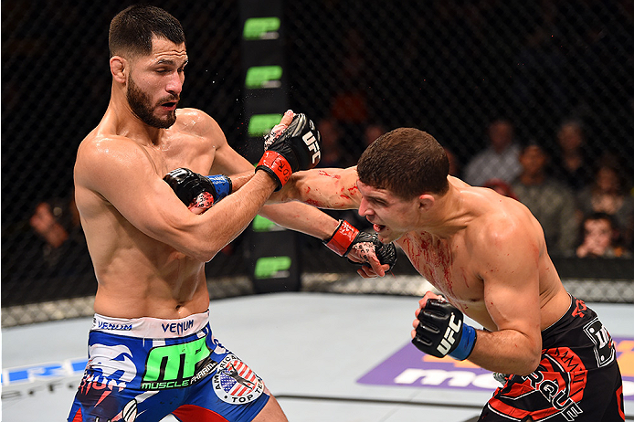 FAIRFAX, VA - APRIL 04: (R-L) Al Iaquinta punches Jorge Masvidal in their lightweight fight during the UFC Fight Night event at the Patriot Center on April 4, 2015 in Fairfax, Virginia. (Photo by Josh Hedges/Zuffa LLC/Zuffa LLC via Getty Images)