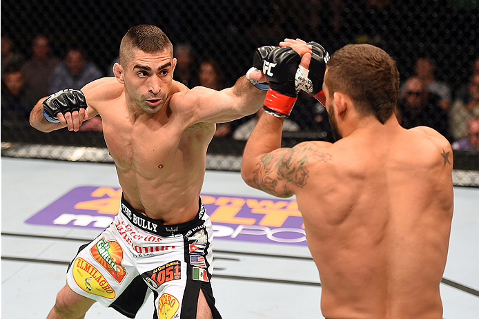 FAIRFAX, VA - APRIL 04: (L-R) Ricardo Lamas throw a punch against Chad Mendes in their featherweight fight during the UFC Fight Night event at the Patriot Center on April 4, 2015 in Fairfax, Virginia. (Photo by Josh Hedges/Zuffa LLC/Zuffa LLC via Getty I