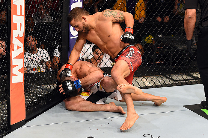 FAIRFAX, VA - APRIL 04: (R-L) Chad Mendes punches Ricardo Lamas in their featherweight fight during the UFC Fight Night event at the Patriot Center on April 4, 2015 in Fairfax, Virginia. (Photo by Josh Hedges/Zuffa LLC/Zuffa LLC via Getty Images)