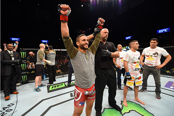 FAIRFAX, VA - APRIL 04: (L-R) Chad Mendes celebrates after defeating Ricardo Lamas in their featherweight fight during the UFC Fight Night event at the Patriot Center on April 4, 2015 in Fairfax, Virginia. (Photo by Josh Hedges/Zuffa LLC/Zuffa LLC via Ge