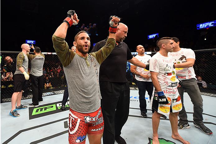FAIRFAX, VA - APRIL 04: (L-R) Chad Mendes celebrates after defeating Ricardo Lamas in their featherweight fight during the UFC Fight Night event at the Patriot Center on April 4, 2015 in Fairfax, Virginia. (Photo by Josh Hedges/Zuffa LLC/Zuffa LLC via Ge