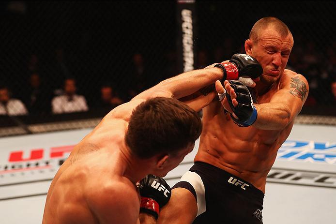 HAMBURG, GERMANY - SEPTEMBER 03: Scott Askham (L) of England punches Jack Hermansson (R) of Sweden in their Middleweight Bout during the UFC Fight Night held at Barclaycard Arena on September 3, 2016 in Hamburg, Germany. (Photo by Dean Mouhtaropoulos/Zu