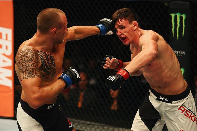 HAMBURG, GERMANY - SEPTEMBER 03: Jack Hermansson (L) of Sweden punches Scott Askham (R) of England in their Middleweight Bout during the UFC Fight Night held at Barclaycard Arena on September 3, 2016 in Hamburg, Germany. (Photo by Dean Mouhtaropoulos/Z