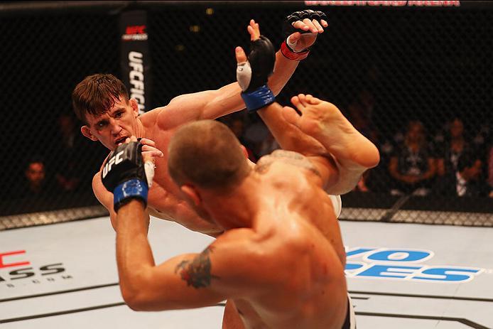 HAMBURG, GERMANY - SEPTEMBER 03: Scott Askham (L) of England kicks facing Jack Hermansson (R) of Sweden in their Middleweight Bout during the UFC Fight Night held at Barclaycard Arena on September 3, 2016 in Hamburg, Germany. (Photo by Dean Mouhtaropoul