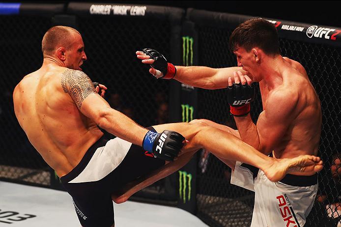 HAMBURG, GERMANY - SEPTEMBER 03: Jack Hermansson (L) of Sweden kicks Scott Askham (R) of England in their Middleweight Bout during the UFC Fight Night held at Barclaycard Arena on September 3, 2016 in Hamburg, Germany. (Photo by Dean Mouhtaropoulos/Zuf