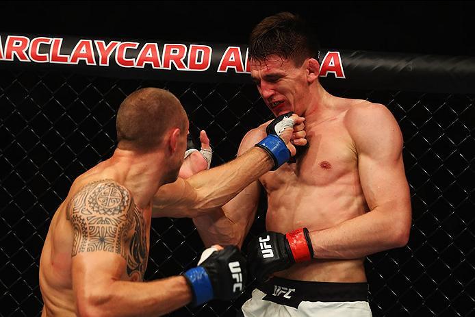 HAMBURG, GERMANY - SEPTEMBER 03: Jack Hermansson (L) of Sweden punches Scott Askham (R) of England in their Middleweight Bout during the UFC Fight Night held at Barclaycard Arena on September 3, 2016 in Hamburg, Germany. (Photo by Dean Mouhtaropoulos/Z