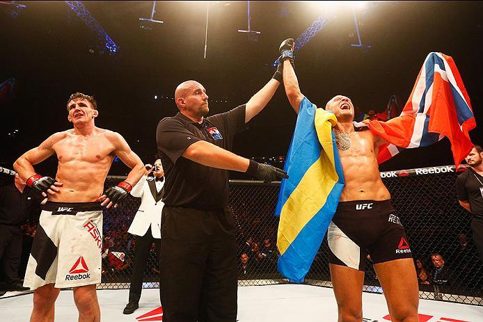 HAMBURG, GERMANY - SEPTEMBER 03: Jack Hermansson (R) of Sweden celebrates his victory over Scott Askham (L) of England compete in their Middleweight Bout during the UFC Fight Night held at Barclaycard Arena on September 3, 2016 in Hamburg, Germany. (Pho