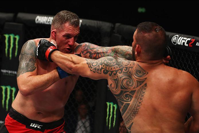 HAMBURG, GERMANY - SEPTEMBER 03: Christian Colombo (L) of Denmark punches Jarjis Danho (R) of Syria compete in their Heavyweight Bout during the UFC Fight Night held at Barclaycard Arena on September 3, 2016 in Hamburg, Germany. (Photo by Dean Mouhtarop