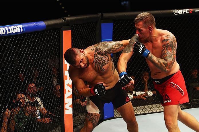 HAMBURG, GERMANY - SEPTEMBER 03: Christian Colombo (R) of Denmark punches Jarjis Danho (L) of Syria compete in their Heavyweight Bout during the UFC Fight Night held at Barclaycard Arena on September 3, 2016 in Hamburg, Germany. (Photo by Dean Mouhtarop