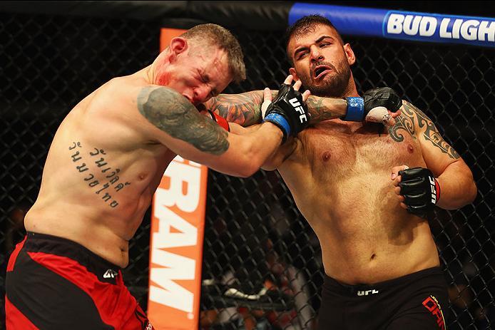 HAMBURG, GERMANY - SEPTEMBER 03: Jarjis Danho (R) of Syria punches Christian Colombo (L) of Denmark in their Heavyweight Bout during the UFC Fight Night held at Barclaycard Arena on September 3, 2016 in Hamburg, Germany. (Photo by Dean Mouhtaropoulos/Z