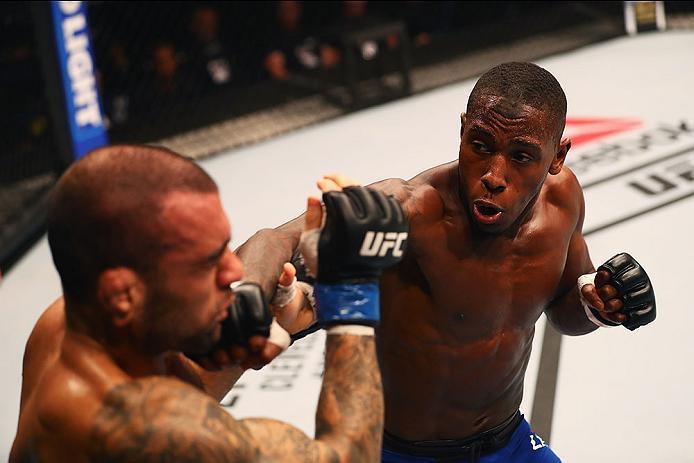 HAMBURG, GERMANY - SEPTEMBER 03: Taylor Lapilus (R) of France punches Leandro Issa (L) of Brazil in their Bantamweight Bout during the UFC Fight Night held at Barclaycard Arena on September 3, 2016 in Hamburg, Germany. (Photo by Dean Mouhtaropoulos/Zuff