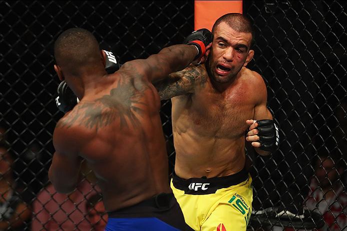 HAMBURG, GERMANY - SEPTEMBER 03: Taylor Lapilus (L) of France punches Leandro Issa (R) of Brazil in their Bantamweight Bout during the UFC Fight Night held at Barclaycard Arena on September 3, 2016 in Hamburg, Germany. (Photo by Dean Mouhtaropoulos/Zuff