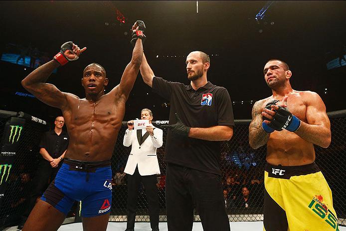 HAMBURG, GERMANY - SEPTEMBER 03: Taylor Lapilus (L) of France celebrates his victory over Leandro Issa (R) of Brasil in their Bantamweight Bout during the UFC Fight Night held at Barclaycard Arena on September 3, 2016 in Hamburg, Germany. (Photo by Dean