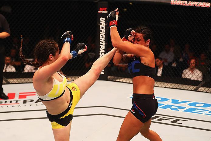HAMBURG, GERMANY - SEPTEMBER 03: Veronica Macedo (L) of Venezuela kicks facing Ashlee Evans-Smith (R) of the USA compete in their Womens Bantamweight Bout during the UFC Fight Night held at Barclaycard Arena on September 3, 2016 in Hamburg, Germany. (Ph