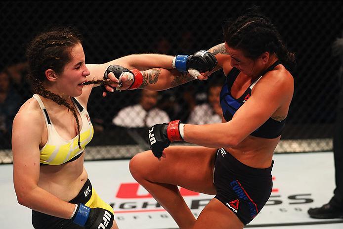 HAMBURG, GERMANY - SEPTEMBER 03: Veronica Macedo (L) of Venezuela punches Ashlee Evans-Smith (R) of the USA compete in their Womens Bantamweight Bout during the UFC Fight Night held at Barclaycard Arena on September 3, 2016 in Hamburg, Germany. (Photo b