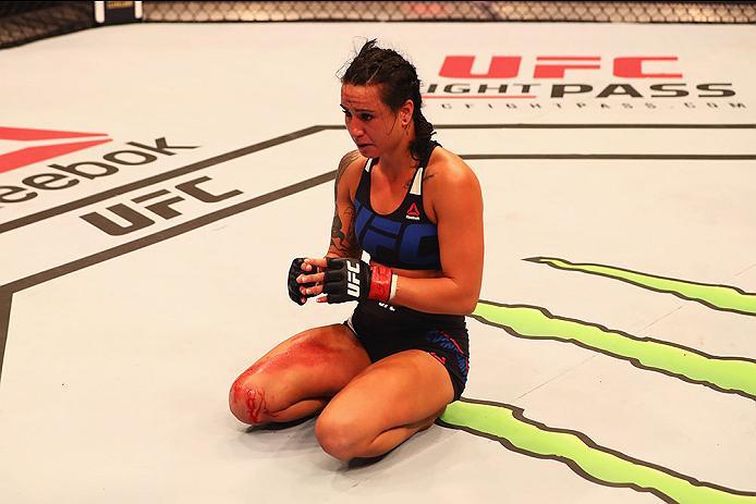 HAMBURG, GERMANY - SEPTEMBER 03: Ashlee Evans-Smith of the USA celebrates his knockout victory over Veronica Macedo of Venezuela in their Womens Bantamweight Bout during the UFC Fight Night held at Barclaycard Arena on September 3, 2016 in Hamburg, Germa