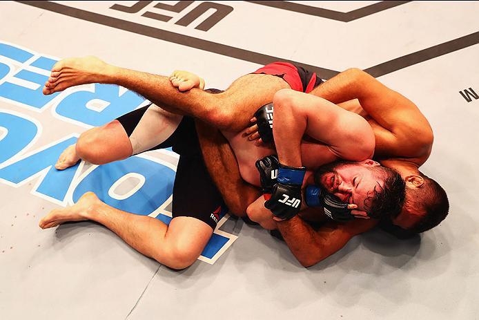 HAMBURG, GERMANY - SEPTEMBER 03: Peter Sobotta (R) of Poland controls the body of of Nicolas Dalby (L) of Denmark in their Welterweight Bout during the UFC Fight Night held at Barclaycard Arena on September 3, 2016 in Hamburg, Germany. (Photo by Dean Mo