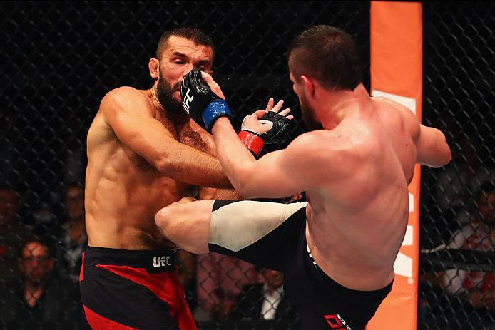 HAMBURG, GERMANY - SEPTEMBER 03: Nicolas Dalby(R) of Denmark kicks facing Peter Sobotta (L) of Poland compete in their Welterweight Bout during the UFC Fight Night held at Barclaycard Arena on September 3, 2016 in Hamburg, Germany. (Photo by Dean Mouht
