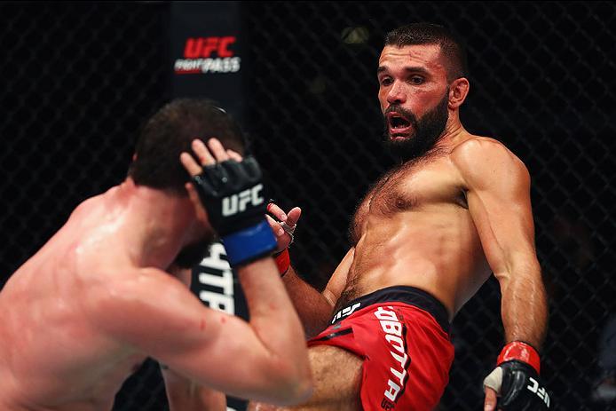 HAMBURG, GERMANY - SEPTEMBER 03: Peter Sobotta (R) of Poland kicks facing Nicolas Dalby (L) of Denmark and compete in their Welterweight Bout during the UFC Fight Night held at Barclaycard Arena on September 3, 2016 in Hamburg, Germany. (Photo by Dean M