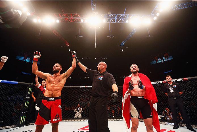 HAMBURG, GERMANY - SEPTEMBER 03: Peter Sobotta (L) of Poland celebrates his victory of Nicolas Dalby (R) of Denmark after in their Welterweight Bout during the UFC Fight Night held at Barclaycard Arena on September 3, 2016 in Hamburg, Germany. (Photo b