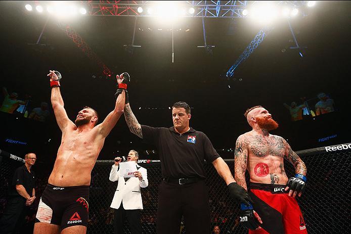 HAMBURG, GERMANY - SEPTEMBER 03: Jessin Ayari (L) of Germany celebrates his victory overJim Wallhead (R) of England and in their Welterweight Bout during the UFC Fight Night held at Barclaycard Arena on September 3, 2016 in Hamburg, Germany. (Photo by