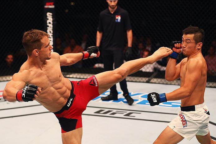 HAMBURG, GERMANY - SEPTEMBER 03: Tae Hyun Bang (R) of South Korea and Nick Hein (L) of Germany compete in their Lightweight Bout during the UFC Fight Night held at Barclaycard Arena on September 3, 2016 in Hamburg, Germany. (Photo by Dean Mouhtaropoulos