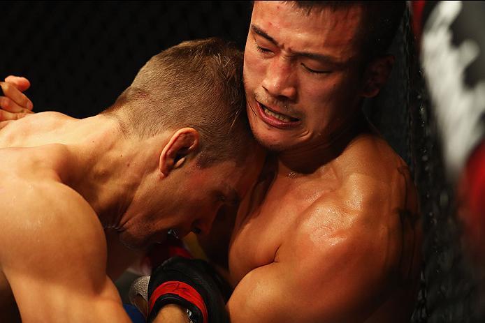 HAMBURG, GERMANY - SEPTEMBER 03: Tae Hyun Bang (R) of South Korea and Nick Hein (L) of Germany compete in their Lightweight Bout during the UFC Fight Night held at Barclaycard Arena on September 3, 2016 in Hamburg, Germany. (Photo by Dean Mouhtaropoulos