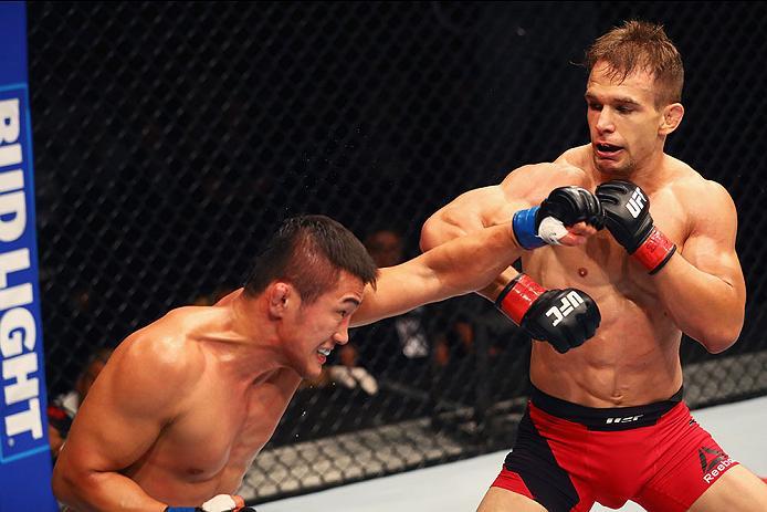 HAMBURG, GERMANY - SEPTEMBER 03: Tae Hyun Bang (L) of South Korea punches Nick Hein (R) of Germany compete in their Lightweight Bout during the UFC Fight Night held at Barclaycard Arena on September 3, 2016 in Hamburg, Germany. (Photo by Dean Mouhtaropo