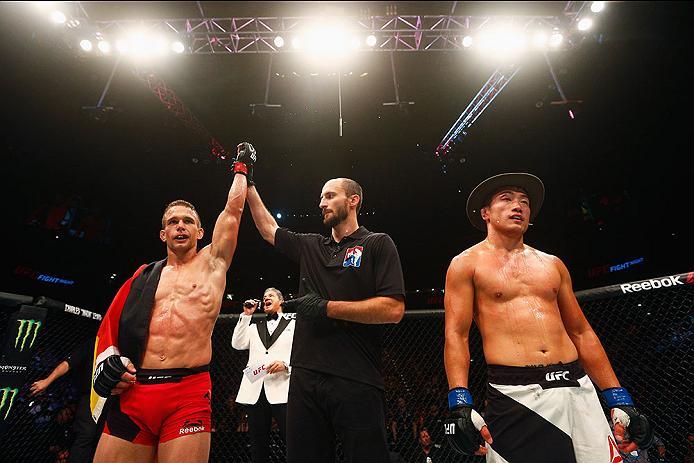 HAMBURG, GERMANY - SEPTEMBER 03: Nick Hein (L) of Germany celebrates his submission victory over
Tae Hyun Bang (R) of South Korea in their Lightweight Bout during the UFC Fight Night held at Barclaycard Arena on September 3, 2016 in Hamburg, Germany. (P