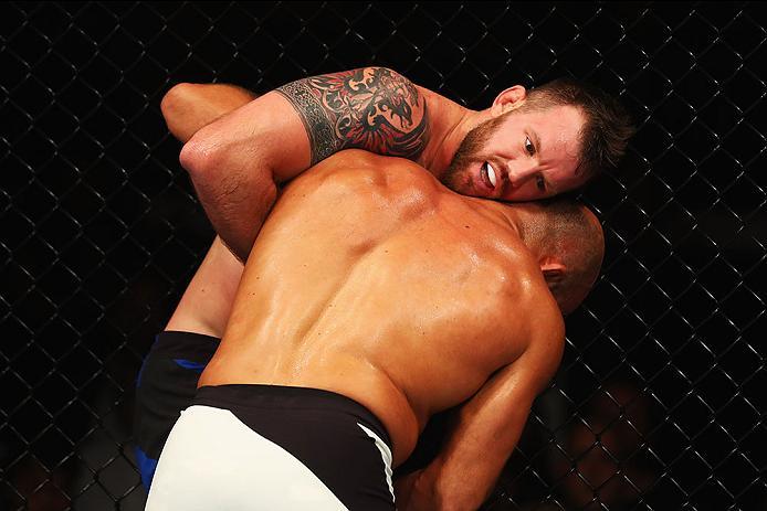 HAMBURG, GERMANY - SEPTEMBER 03: Ilir Latifi (R) of Sweden controls the body of Ryan Bader (L) of the USA compete in their Light Heavyweight Bout during the UFC Fight Night held at Barclaycard Arena on September 3, 2016 in Hamburg, Germany. (Photo by De