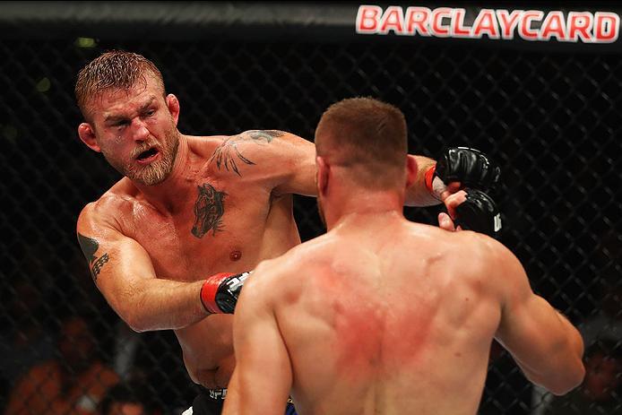 HAMBURG, GERMANY - SEPTEMBER 03: Alexander Gustafsson (L) of Sweden punches Jan Blachowicz (R) of Poland compete in their Light Heavyweight Bout during the UFC Fight Night held at Barclaycard Arena on September 3, 2016 in Hamburg, Germany. (Photo by Dea