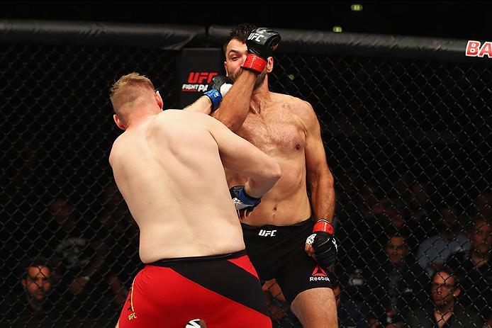 HAMBURG, GERMANY - SEPTEMBER 03: Josh Barnett (L) of USA and Andrei Arlovski (R) of Belarus compete in their Heavyweight Bout during the UFC Fight Night held at Barclaycard Arena at Barclaycard Arena on September 3, 2016 in Hamburg, Germany. (Photo by