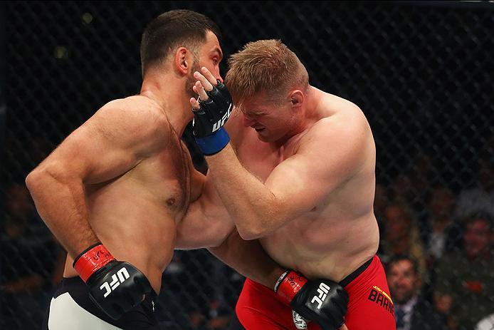 HAMBURG, GERMANY - SEPTEMBER 03: Josh Barnett (R) of USA and Andrei Arlovski (L) of Belarus compete in their Heavyweight Bout during the UFC Fight Night held at Barclaycard Arena at Barclaycard Arena on September 3, 2016 in Hamburg, Germany. (Photo by