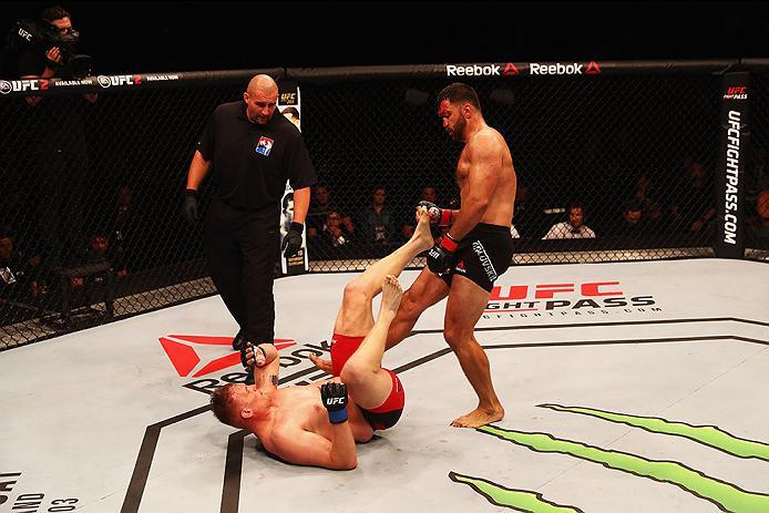 HAMBURG, GERMANY - SEPTEMBER 03: Josh Barnett (L) of USA and Andrei Arlovski (R) of Belarus compete in their Heavyweight Bout during the UFC Fight Night held at Barclaycard Arena at Barclaycard Arena on September 3, 2016 in Hamburg, Germany. (Photo by