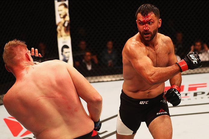 HAMBURG, GERMANY - SEPTEMBER 03: Josh Barnett (L) of USA and Andrei Arlovski (R) of Belarus compete in their Heavyweight Bout during the UFC Fight Night held at Barclaycard Arena at Barclaycard Arena on September 3, 2016 in Hamburg, Germany. (Photo by D