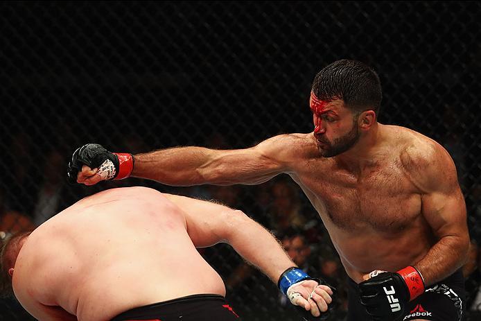 HAMBURG, GERMANY - SEPTEMBER 03: Josh Barnett (L) of USA and Andrei Arlovski (R) of Belarus compete in their Heavyweight Bout during the UFC Fight Night held at Barclaycard Arena at Barclaycard Arena on September 3, 2016 in Hamburg, Germany. (Photo by
