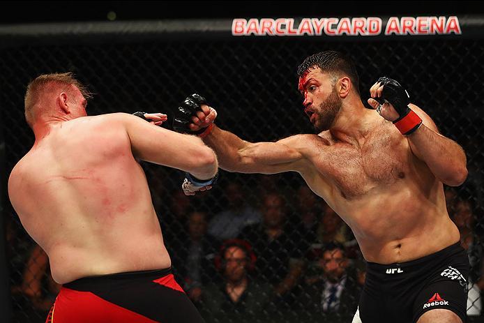 HAMBURG, GERMANY - SEPTEMBER 03: Josh Barnett (L) of USA and Andrei Arlovski (R) of Belarus compete in their Heavyweight Bout during the UFC Fight Night held at Barclaycard Arena at Barclaycard Arena on September 3, 2016 in Hamburg, Germany. (Photo by