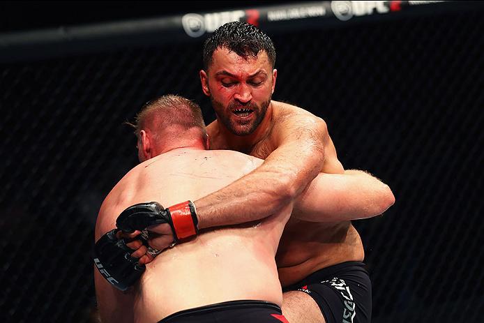 HAMBURG, GERMANY - SEPTEMBER 03: Josh Barnett (L) of USA controls the body of Andrei Arlovski (R) of Belarus compete in their Heavyweight Bout during the UFC Fight Night held at Barclaycard Arena at Barclaycard Arena on September 3, 2016 in Hamburg, Ger