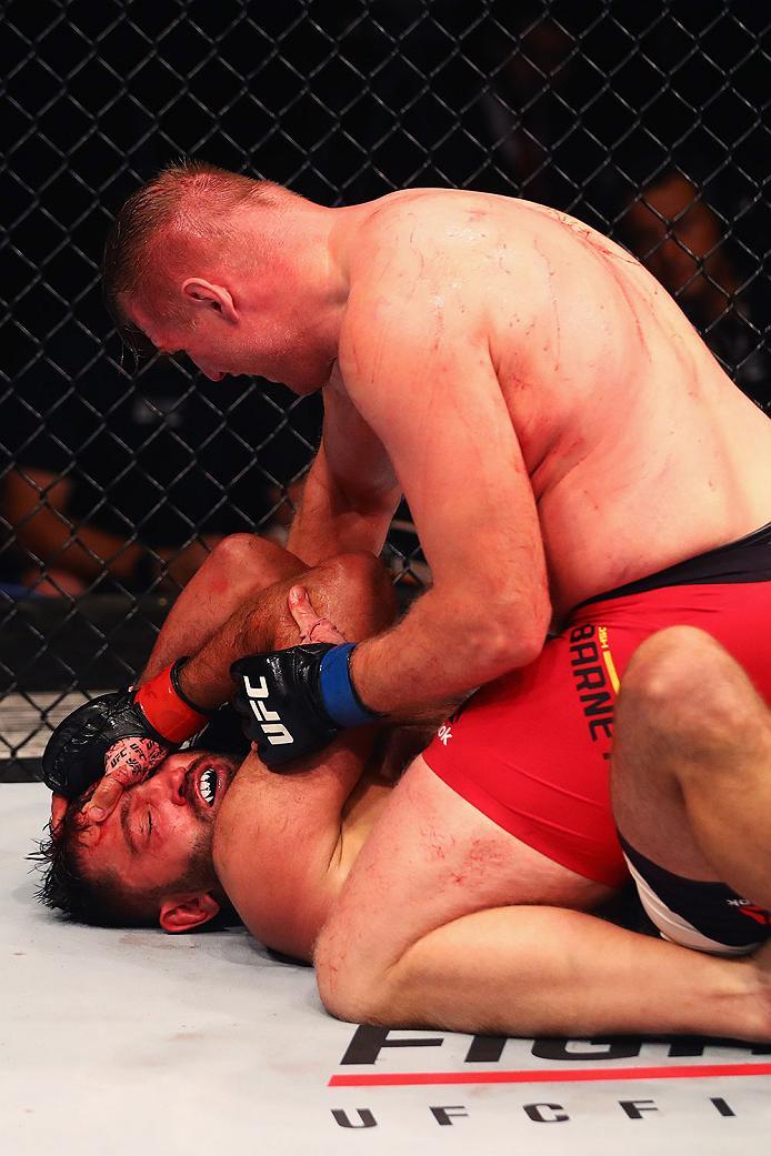 HAMBURG, GERMANY - SEPTEMBER 03: Josh Barnett (top) of USA controls the body of Andrei Arlovski (L) of Belarus compete in their Heavyweight Bout during the UFC Fight Night held at Barclaycard Arena at Barclaycard Arena on September 3, 2016 in Hamburg, G