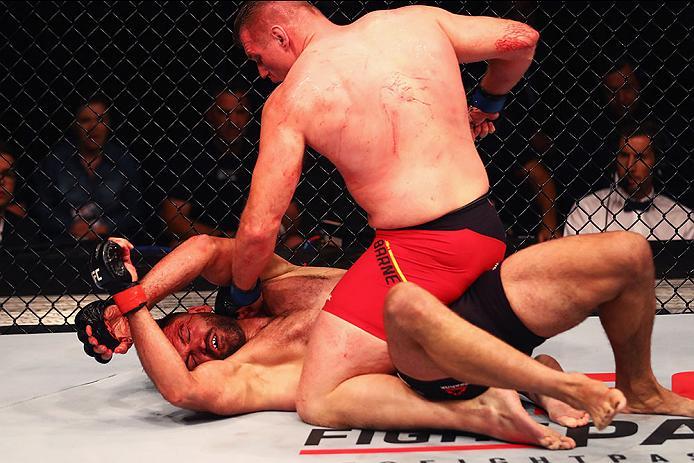 HAMBURG, GERMANY - SEPTEMBER 03: Josh Barnett (top) of USA controls the body of Andrei Arlovski (L) of Belarus compete in their Heavyweight Bout during the UFC Fight Night held at Barclaycard Arena at Barclaycard Arena on September 3, 2016 in Hamburg, G