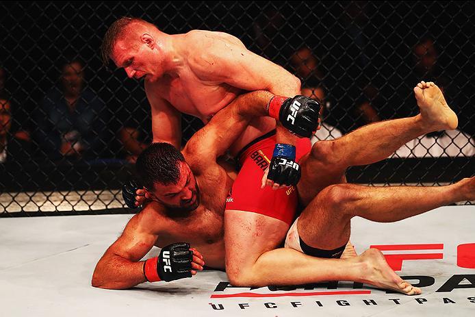 HAMBURG, GERMANY - SEPTEMBER 03: Josh Barnett (top) of USA controls the body of Andrei Arlovski (L) of Belarus compete in their Heavyweight Bout during the UFC Fight Night held at Barclaycard Arena at Barclaycard Arena on September 3, 2016 in Hamburg, G