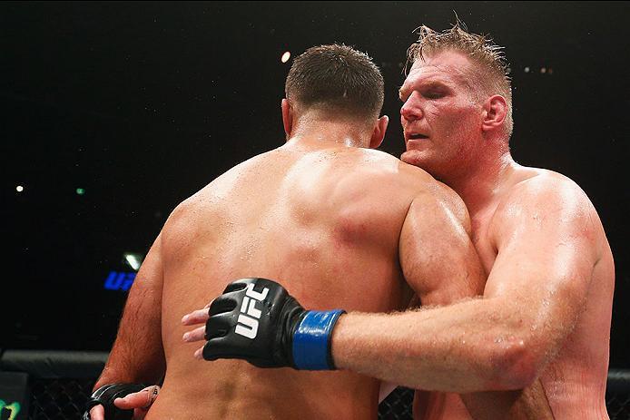 HAMBURG, GERMANY - SEPTEMBER 03: Josh Barnett (R) of USA celebrates his victory over Andrei Arlovski (L) of Belarus in their Heavyweight Bout during the UFC Fight Night held at Barclaycard Arena at Barclaycard Arena on September 3, 2016 in Hamburg, Germ
