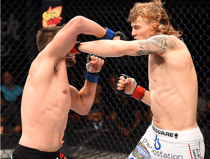 HOLLYWOOD, FL - JUNE 27: (R-L) Steve Montgomery punches Tony Sims in their welterweight during the UFC Fight Night event at the Hard Rock Live on June 27, 2015 in Hollywood, Florida. (Photo by Josh Hedges/Zuffa LLC/Zuffa LLC via Getty Images)