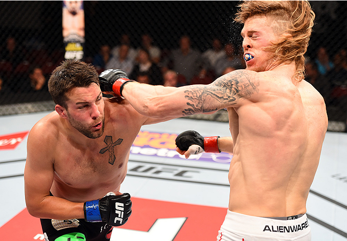 HOLLYWOOD, FL - JUNE 27: (L-R) Tony Sims punches Steve Montgomery in their welterweight during the UFC Fight Night event at the Hard Rock Live on June 27, 2015 in Hollywood, Florida. (Photo by Josh Hedges/Zuffa LLC/Zuffa LLC via Getty Images)