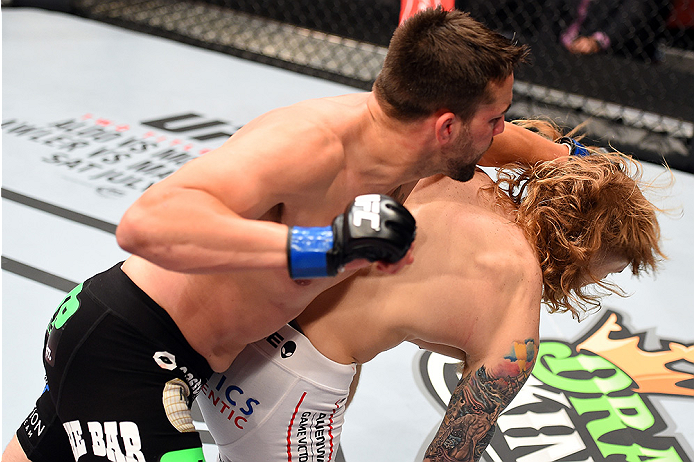 HOLLYWOOD, FL - JUNE 27: (L-R) Tony Sims punches Steve Montgomery in their welterweight during the UFC Fight Night event at the Hard Rock Live on June 27, 2015 in Hollywood, Florida. (Photo by Josh Hedges/Zuffa LLC/Zuffa LLC via Getty Images)